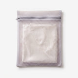 The Wash Bag with a folded ivory silk pillowcase zipped inside