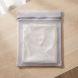 The Wash Bag with a folded ivory silk pillowcase zipped inside